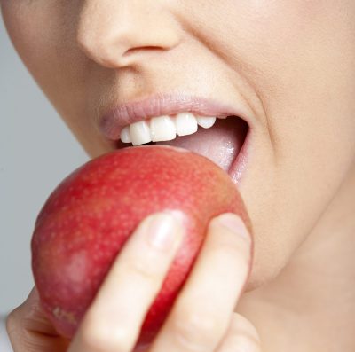 beautiful-young-woman-eating-an-apple-wearing-a-wh-2026-01-11-09-34-50-utc